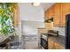 Kitchen with stainless steel appliances and wood cabinets at 10687 W 107Th Ave, Broomfield, CO 80021