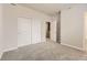 Bedroom with closet featuring sliding doors and neutral carpet at 27482 E 1St Ave, Aurora, CO 80018