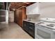 Unfinished basement with utility sink, appliances, and plenty of storage space at 6572 E Dakota Ave, Denver, CO 80224