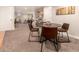 Finished basement with dining area, seating, and game shelves at 6572 E Dakota Ave, Denver, CO 80224