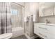 Clean bathroom with tub, shower, and updated vanity and fixtures at 6572 E Dakota Ave, Denver, CO 80224