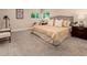 Spacious bedroom with plush carpet, a queen-sized bed, and plenty of natural light at 6572 E Dakota Ave, Denver, CO 80224