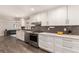 Spacious kitchen featuring modern appliances, ample counter space, and sleek design elements at 6572 E Dakota Ave, Denver, CO 80224