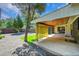 Covered patio with artificial turf and a backyard with gravel at 1596 S Stuart St, Denver, CO 80219