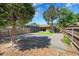 Fenced backyard with parking and a small manicured lawn at 1596 S Stuart St, Denver, CO 80219