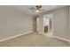 Bedroom featuring an ensuite bathroom, neutral walls and carpet with ample natural light at 1596 S Stuart St, Denver, CO 80219