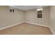 Small carpeted bedroom with natural lighting and a view from the window at 1596 S Stuart St, Denver, CO 80219