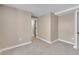 Bedroom with neutral carpet and paint, complemented by clean white trim and baseboards at 1596 S Stuart St, Denver, CO 80219