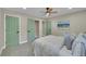 Comfortable bedroom features a plush bed and tranquil atmosphere with stylish doors and modern lighting fixtures at 1596 S Stuart St, Denver, CO 80219
