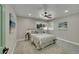 Cozy bedroom with ample natural light, complemented by modern décor and plush carpeting for a tranquil retreat at 1596 S Stuart St, Denver, CO 80219