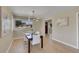 Bright dining room featuring stylish lighting and modern decor that enhances the space's aesthetic appeal at 1596 S Stuart St, Denver, CO 80219