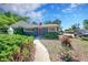 Cozy single story home featuring a well-maintained lawn and a paved walkway leading to the front entrance at 1596 S Stuart St, Denver, CO 80219