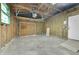 An empty unfinished garage space with wood framing and a concrete floor at 1596 S Stuart St, Denver, CO 80219