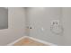 Laundry room with new flooring, hookups, and neutral paint at 1596 S Stuart St, Denver, CO 80219