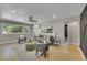 Bright living room featuring stylish seating and lighting, seamlessly flowing into adjacent areas for easy living at 1596 S Stuart St, Denver, CO 80219