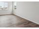 Simple bedroom with vinyl plank flooring and neutral walls at 1391 Zenith Heights Ct, Erie, CO 80516