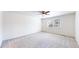 Empty bedroom with light grey carpet, a ceiling fan, and natural light at 2314 Flagstaff Dr, Longmont, CO 80504