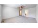 Large bedroom with soft carpet, neutral walls, and a ceiling fan at 2314 Flagstaff Dr, Longmont, CO 80504