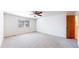 Spacious bedroom with soft carpet, a ceiling fan, and natural light at 2314 Flagstaff Dr, Longmont, CO 80504