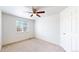 Bright bedroom features a ceiling fan and a window providing natural light at 2314 Flagstaff Dr, Longmont, CO 80504