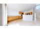 Bright kitchen with oak cabinets, light countertops, black appliances, and hardwood floors at 2314 Flagstaff Dr, Longmont, CO 80504