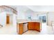Open-concept kitchen with stainless steel appliances and view of the living area at 2314 Flagstaff Dr, Longmont, CO 80504