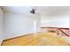 Open living area with hardwood floors, a ceiling fan, and lots of light at 2314 Flagstaff Dr, Longmont, CO 80504