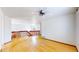 Spacious living room featuring hardwood floors, lots of light, and a red railing at 2314 Flagstaff Dr, Longmont, CO 80504