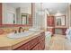 Bright bathroom boasting a large vanity, elegant fixtures, and ample cabinet space at 1 Gooseberry Ln, Cherry Hills Village, CO 80113