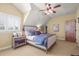Vaulted ceiling bedroom with plush bedding, stylish side tables and lots of natural light at 1 Gooseberry Ln, Cherry Hills Village, CO 80113