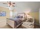 Cozy bedroom features neutral color palette, ceiling fan, and accent chair at 1 Gooseberry Ln, Cherry Hills Village, CO 80113