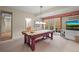 Game room with pool table, recessed lighting, and access to the outdoor patio at 1 Gooseberry Ln, Cherry Hills Village, CO 80113