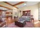 Bright living room with hardwood floors, stone accents, and comfortable seating, perfect for entertaining at 1 Gooseberry Ln, Cherry Hills Village, CO 80113