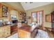Well-appointed home office featuring custom built-ins, rich wood accents, and a large window at 1 Gooseberry Ln, Cherry Hills Village, CO 80113