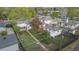 Lush backyard featuring well-maintained lawn, mature trees, and a covered patio for outdoor relaxation at 5115 Bryant St, Denver, CO 80221