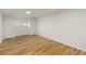 Bright bedroom features gleaming hardwood floors, neutral paint, and ample closet space at 5115 Bryant St, Denver, CO 80221