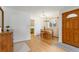 Inviting dining room with hardwood floors, chandelier, and natural light at 5115 Bryant St, Denver, CO 80221