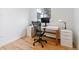 Functional home office with a modern desk, ergonomic chair, and ample natural light at 5115 Bryant St, Denver, CO 80221
