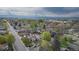 Charming neighborhood with tree-lined streets and beautiful mountain views in the distance at 5115 Bryant St, Denver, CO 80221