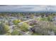 Scenic aerial view of the neighborhood showcasing mature trees and a peaceful residential setting at 5115 Bryant St, Denver, CO 80221