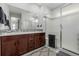 Double vanity bathroom with a large shower and tiled flooring at 10761 N Montane Dr, Broomfield, CO 80021