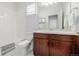 Bathroom with tub, toilet, and wood vanity at 10761 N Montane Dr, Broomfield, CO 80021