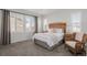 Bright bedroom featuring a comfortable bed and window seating at 10761 N Montane Dr, Broomfield, CO 80021