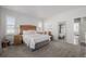 Well-lit bedroom with a queen-size bed and mirrored closet doors at 10761 N Montane Dr, Broomfield, CO 80021