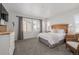 Spacious bedroom with large windows and plush carpeting at 10761 N Montane Dr, Broomfield, CO 80021