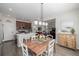 Open concept dining room adjacent to kitchen and living room at 10761 N Montane Dr, Broomfield, CO 80021