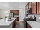 Modern kitchen with stainless steel appliances and island at 10761 N Montane Dr, Broomfield, CO 80021