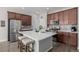 Modern kitchen with stainless steel appliances and island at 10761 N Montane Dr, Broomfield, CO 80021