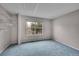 This bedroom features a window with natural light and carpet flooring at 11901 E Kepner Dr, Aurora, CO 80012