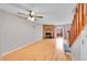 Bright living room with hardwood floors, a brick fireplace and large window at 11901 E Kepner Dr, Aurora, CO 80012